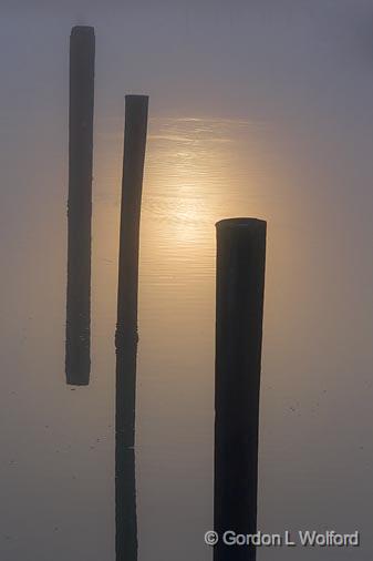 Pilings In Sun's Foggy Reflection_32028.jpg - Photographed along the Gulf coast near Port Lavaca, Texas, USA.